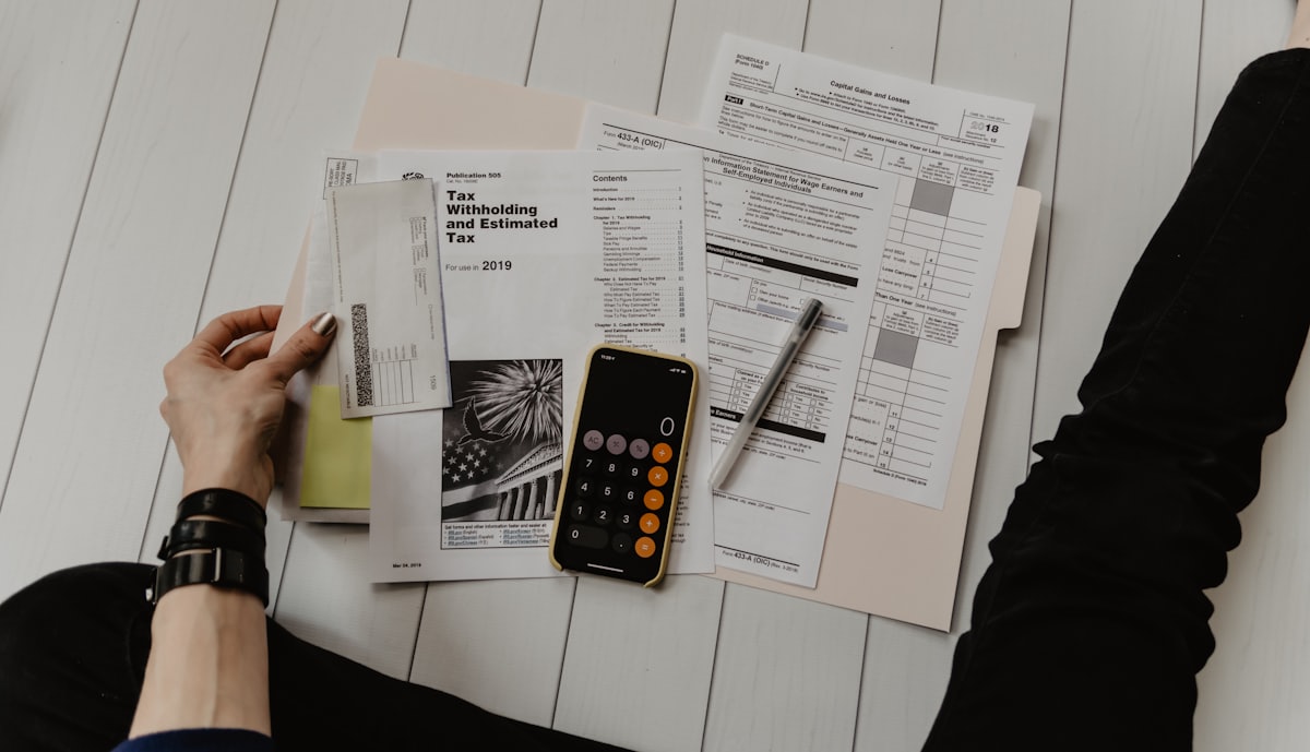 A desk with documents and a calculator during GST filing work