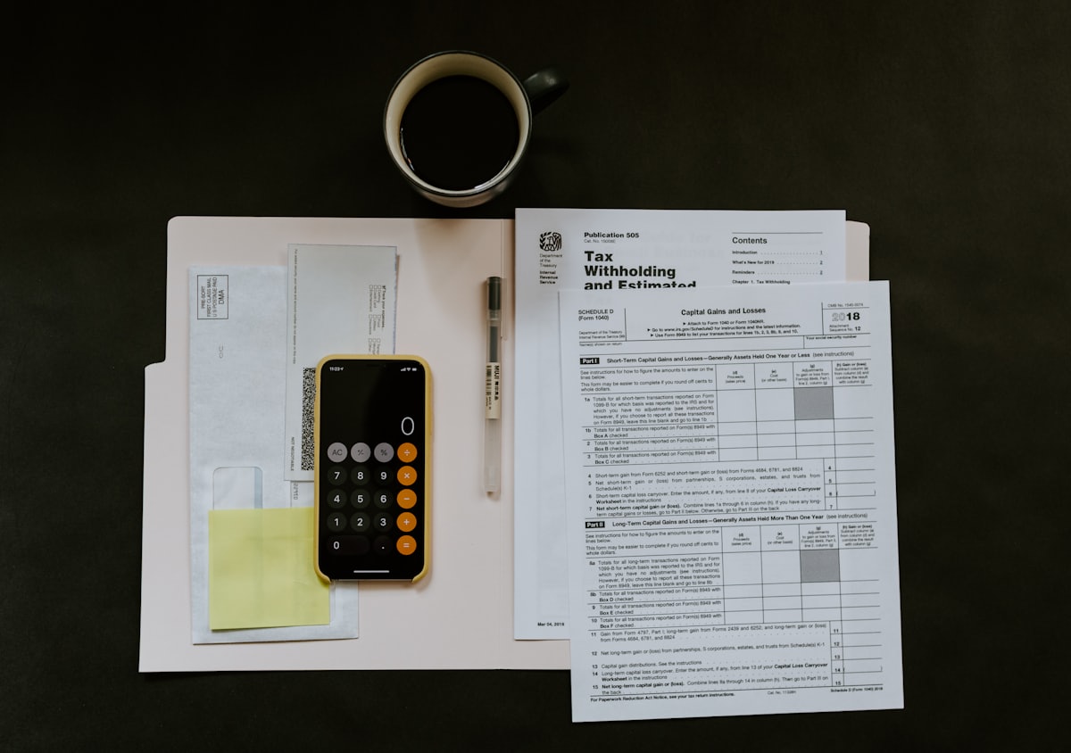 Payroll documents and paperwork on a desk