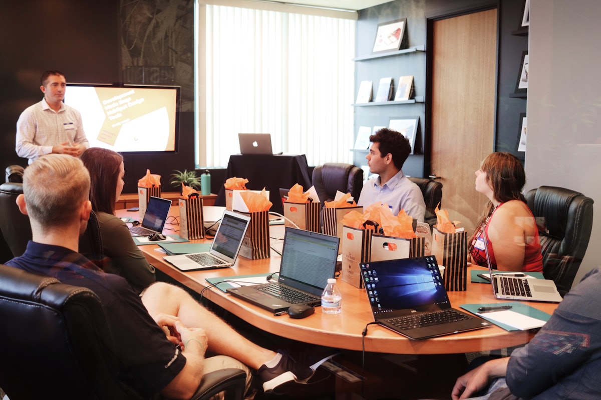 Laptop and notes on an office desk during TDS return preparation